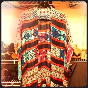 A long multi color light cardigan